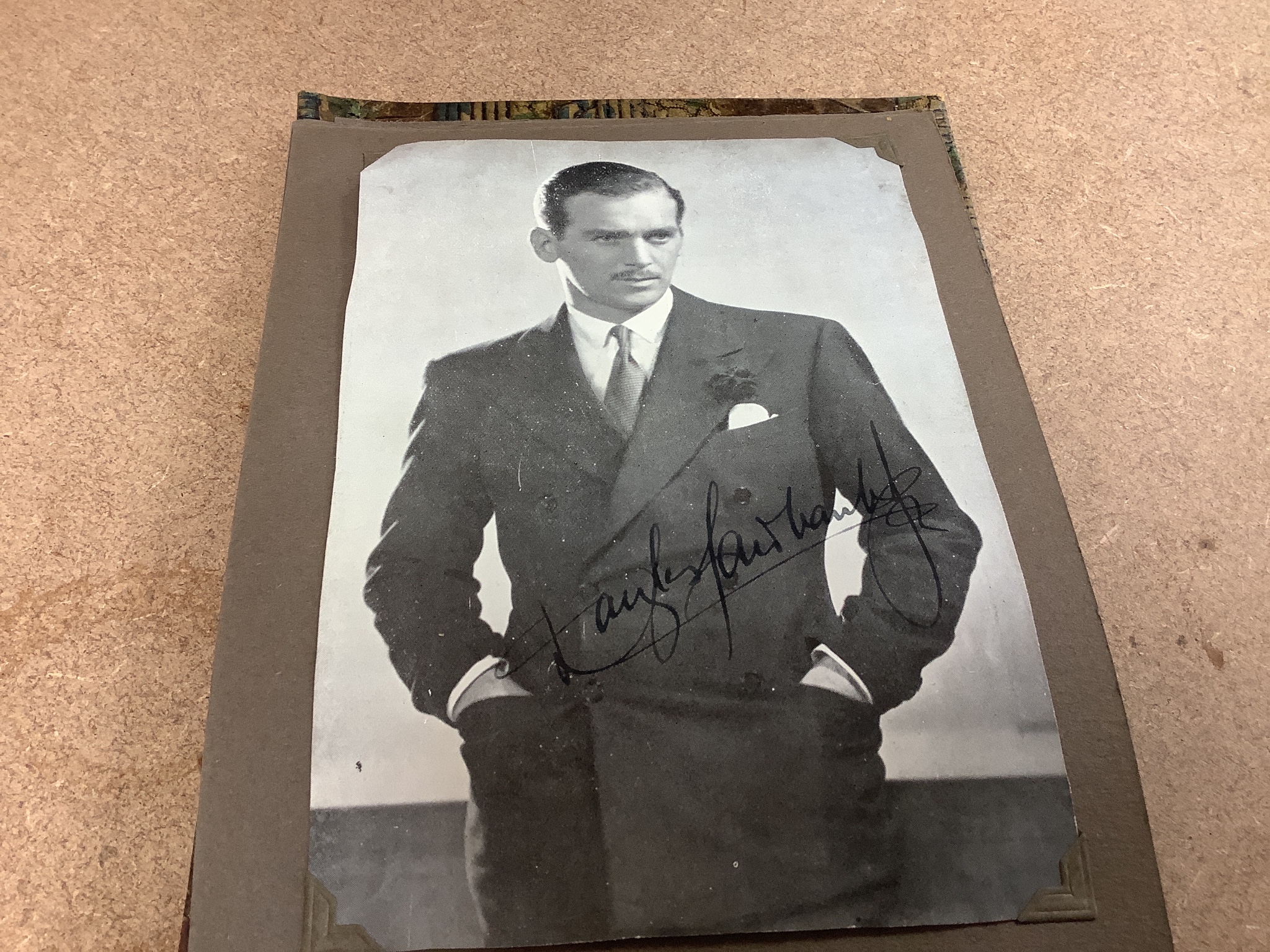 An album of 1930s monochrome postcards including film stars, some signed, letter and other signatures